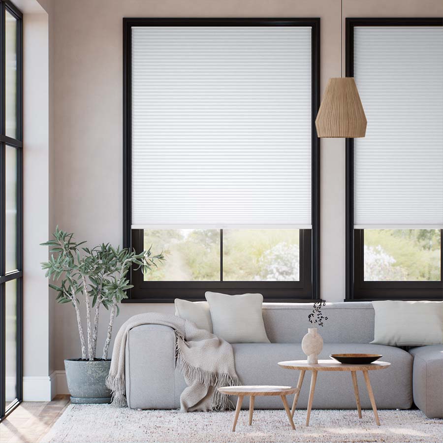 Light-filtering cellular shades in a master bedroom — soft diffused glow