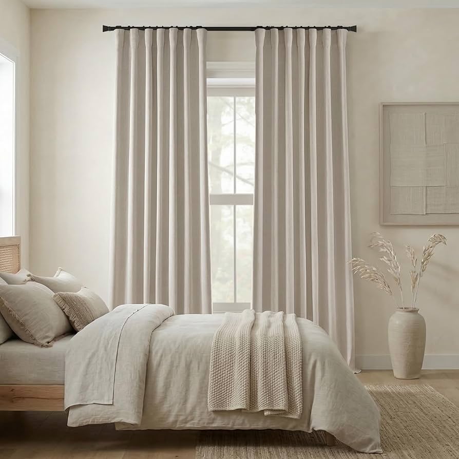 Velvet drapery panels framing tall windows in a luxury dining room