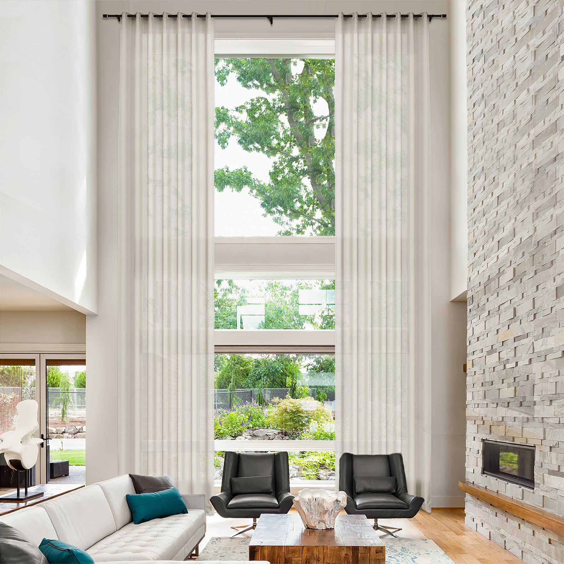 Linen drapery panels pooling softly in a master bedroom